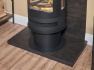 acantha-tile-hearth-set-in-bronze-venetian-plaster-effect-with-orbit-cylinder-stove-tall-angled-pipe